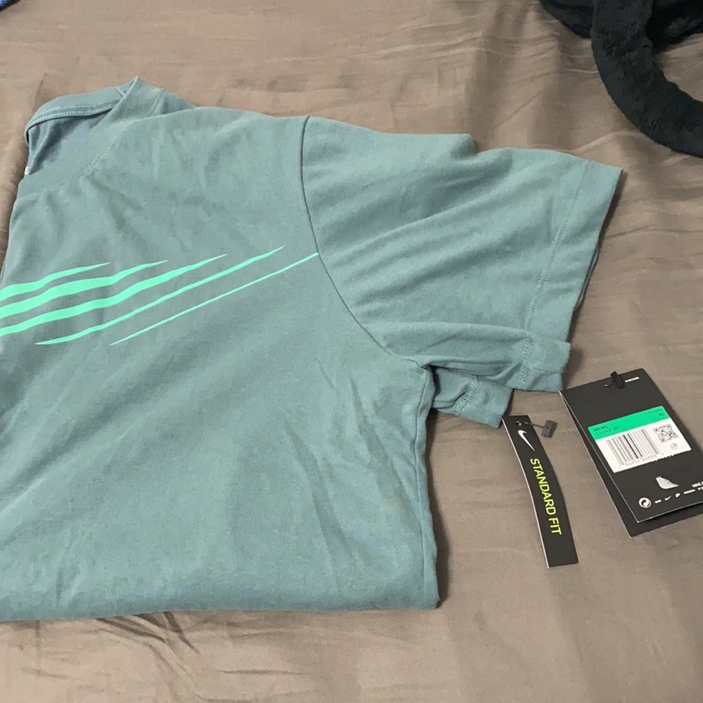 BRAND NEW NIKE TEE SIZE XL!!! Aqua green on a lime green logo. Dri-Fit material